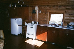 Kitchen with window overlooking meadow and creek