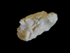 Pale yellow stone with crystals